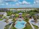 Aerial view showcasing a recreation center with a pool, and lush landscaping at 32721 Brooks Hawk Ln, Wesley Chapel, FL 33543