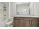 Bathroom features double sink vanity with cabinet storage, toilet, and shower at 32721 Brooks Hawk Ln, Wesley Chapel, FL 33543