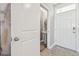 Bright entryway with a view of the powder room at 32721 Brooks Hawk Ln, Wesley Chapel, FL 33543