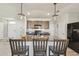 Bright kitchen featuring stainless steel appliances, center island, and stylish pendant lighting at 32721 Brooks Hawk Ln, Wesley Chapel, FL 33543