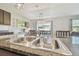 Bright kitchen featuring stainless steel sink, modern countertops, and stylish pendant lighting at 32721 Brooks Hawk Ln, Wesley Chapel, FL 33543