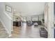 Open concept living room with kitchen, dining room and access to backyard at 32721 Brooks Hawk Ln, Wesley Chapel, FL 33543