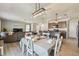Open concept living and dining area with modern decor, and great natural light at 32721 Brooks Hawk Ln, Wesley Chapel, FL 33543