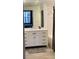Bathroom featuring shower, tub and granite countertop vanity with storage at 402 S Armenia Ave # 127, Tampa, FL 33609