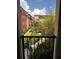 Scenic courtyard view with colorful building exteriors and lush landscaping from the balcony at 402 S Armenia Ave # 127, Tampa, FL 33609