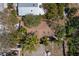 This aerial view shows the layout of the home and its location in a lush, established neighborhood at 407 Indiana Ave, Crystal Beach, FL 34681