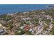 Explore the community from an aerial perspective, showcasing lush greenery and proximity to the bay at 407 Indiana Ave, Crystal Beach, FL 34681