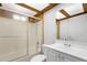 Bathroom featuring a shower and tub combo, vanity, and unique skylight at 407 Indiana Ave, Crystal Beach, FL 34681