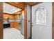 Bright, practical kitchen with stainless steel appliances and an adjacent doorway at 407 Indiana Ave, Crystal Beach, FL 34681