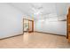 Spacious living room boasts tile floors, white ceilings with a fan, and a bright view at 407 Indiana Ave, Crystal Beach, FL 34681