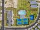 Aerial shot of community amenities including parking, pool, basketball court, and tennis courts at 44239 Frontier Dr, Punta Gorda, FL 33982