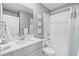 Bathroom with a vanity, mirror, and a shower/tub combination with a shower curtain at 44239 Frontier Dr, Punta Gorda, FL 33982
