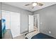 Well-lit bedroom with grey walls, white trim, and a closet, offering a cozy and inviting atmosphere at 44239 Frontier Dr, Punta Gorda, FL 33982