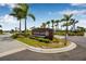 Crescent Lakes entrance sign with palm trees and lush landscaping at 44239 Frontier Dr, Punta Gorda, FL 33982