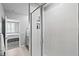 Glass enclosed shower with white subway tile and built-in storage niche at 44239 Frontier Dr, Punta Gorda, FL 33982