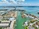 Aerial view showcasing the waterfront community with private docks and easy access to the bay at 455 Pinellas Bayway S # 3B, Tierra Verde, FL 33715