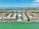 Aerial view of waterfront condos featuring boat docks and beautiful water views at 455 Pinellas Bayway S # 3B, Tierra Verde, FL 33715