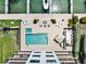 Aerial view of the waterfront condo community pool, spa, and boat docks at 455 Pinellas Bayway S # 3B, Tierra Verde, FL 33715