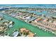 Panoramic aerial view of the waterfront community, showing the building’s location with boat docks and nearby canals at 455 Pinellas Bayway S # 3B, Tierra Verde, FL 33715