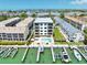 A stunning aerial view showcasing the building's private pool and boat docks, offering an exclusive waterfront lifestyle at 455 Pinellas Bayway S # 3B, Tierra Verde, FL 33715