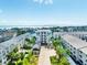 An impressive aerial perspective of the condo building, highlighting the well-manicured grounds and prime location at 455 Pinellas Bayway S # 3B, Tierra Verde, FL 33715