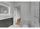 Modern bathroom featuring a shower, toilet, and vanity with good lighting and marble finishes at 455 Pinellas Bayway S # 3B, Tierra Verde, FL 33715