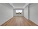 Bright bedroom with hardwood floors and modern trim with a view of the water at 455 Pinellas Bayway S # 3B, Tierra Verde, FL 33715