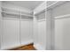 Spacious walk-in closet with built-in shelving and rods, designed for organized storage at 455 Pinellas Bayway S # 3B, Tierra Verde, FL 33715