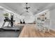 Spacious exercise room features fitness equipment, high ceilings, and natural light at 455 Pinellas Bayway S # 3B, Tierra Verde, FL 33715