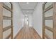 Elegant hallway with wood floors, recessed lighting, and stylish doors, creating a welcoming atmosphere at 455 Pinellas Bayway S # 3B, Tierra Verde, FL 33715