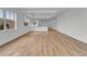 Spacious living room with modern hardwood floors and natural light streaming through the windows at 455 Pinellas Bayway S # 3B, Tierra Verde, FL 33715