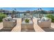 Inviting outdoor seating area on a brick patio, perfect for enjoying waterfront views and relaxation at 455 Pinellas Bayway S # 3B, Tierra Verde, FL 33715