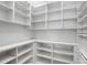 Organized walk-in pantry with custom shelving and ample storage space for all your kitchen needs at 455 Pinellas Bayway S # 3B, Tierra Verde, FL 33715