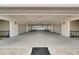 Well-lit parking garage with multiple parking spaces and a view of the exterior at 455 Pinellas Bayway S # 3B, Tierra Verde, FL 33715