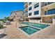 An inviting pool and spa area with comfortable lounge seating for relaxing and entertaining at 455 Pinellas Bayway S # 3B, Tierra Verde, FL 33715