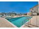 Inviting pool area with lounge chairs and a clear blue sky at 455 Pinellas Bayway S # 3B, Tierra Verde, FL 33715