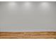 Close up of a gray painted wall with white trim and hardwood floors at 455 Pinellas Bayway S # 3B, Tierra Verde, FL 33715