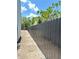 Newly installed metal fence provides privacy and security around the perimeter of the property at 4716 W Lawn Ave, Tampa, FL 33611