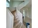 Elegant curved staircase with unfinished wood steps ready for customization at 4716 W Lawn Ave, Tampa, FL 33611