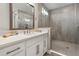 This bathroom features a glass shower, white cabinets, and a white counter at 4784 San Martino Dr, Wesley Chapel, FL 33543