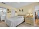 Comfortable bedroom with neutral tones, closet space, and adjacent bathroom for added convenience at 4819 Boonesboro Ct, New Port Richey, FL 34655