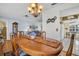 This dining room features beautiful hardwood floors, chandelier and access to the living room and kitchen at 4819 Boonesboro Ct, New Port Richey, FL 34655