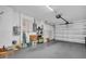 The image highlights an attached garage with a working garage door and ample open storage and workspace potential at 4819 Boonesboro Ct, New Port Richey, FL 34655