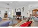 A light-filled living room features neutral walls, wood flooring, and a view of the home's front entrance at 4819 Boonesboro Ct, New Port Richey, FL 34655