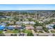 Aerial view showcasing the single-Gathering homes with mature trees and well-maintained landscaping in a great neighborhood at 5053 43Rd S St, St Petersburg, FL 33711
