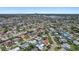 Aerial view showing the neighborhood with mature trees and single-Gathering homes under clear skies at 5053 43Rd S St, St Petersburg, FL 33711