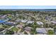 Wide aerial view showcasing the single-Gathering homes in this desirable neighborhood and the ocean nearby at 5053 43Rd S St, St Petersburg, FL 33711