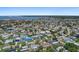 Expansive aerial view of neighborhood homes near tranquil bay waters, offering picturesque scenery at 5053 43Rd S St, St Petersburg, FL 33711
