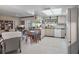 Open kitchen featuring light wood cabinets, neutral countertops, and a casual dining area for Gathering meals at 5053 43Rd S St, St Petersburg, FL 33711
