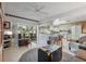 Open-concept living room and kitchen area with sliding doors to outdoor seating at 5053 43Rd S St, St Petersburg, FL 33711